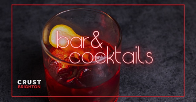 Bar and cocktails at Crust Brighton: a red cocktail with ice